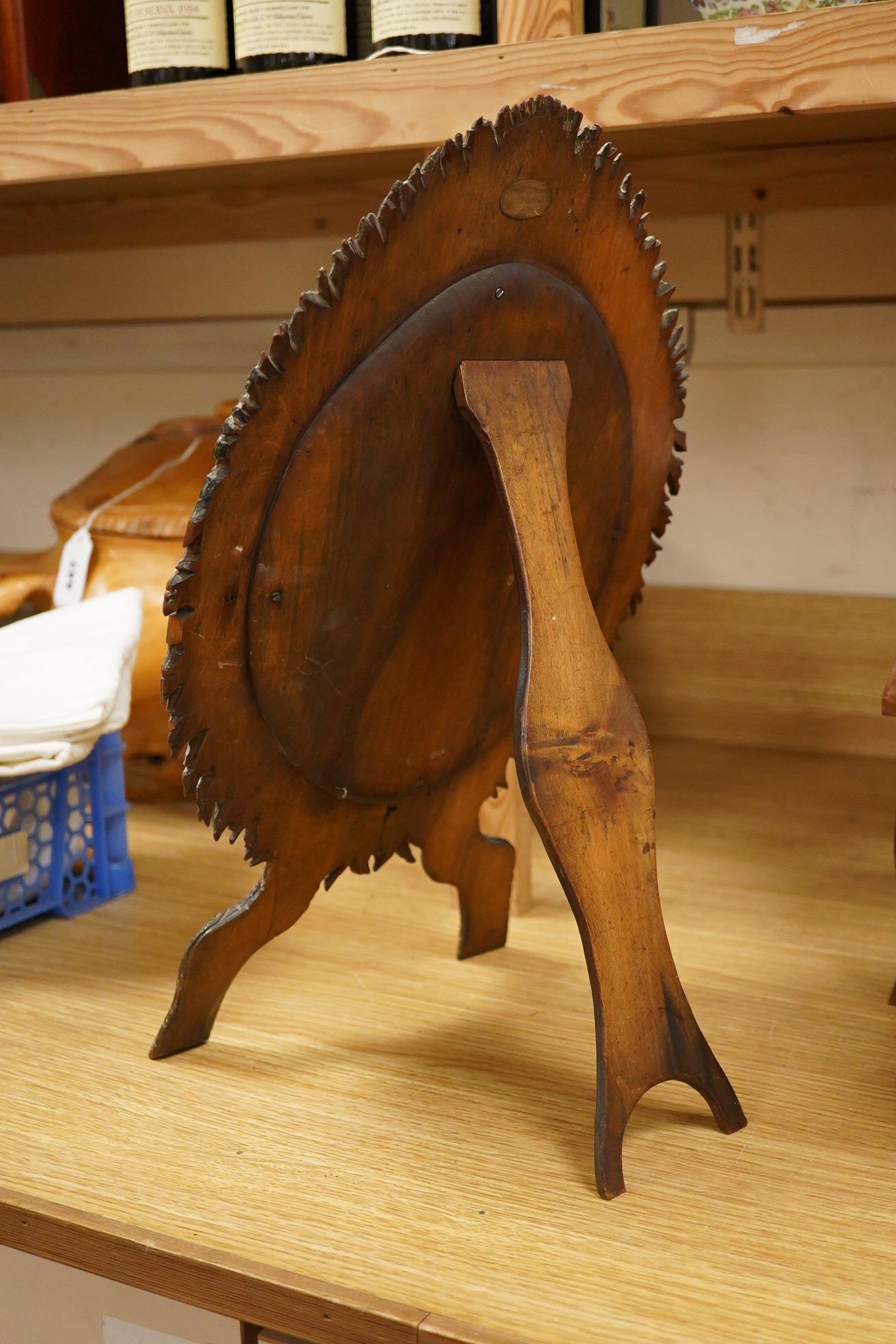 A framed botanical print, circular mirror, floral wood block and a set of 6 metal place mats